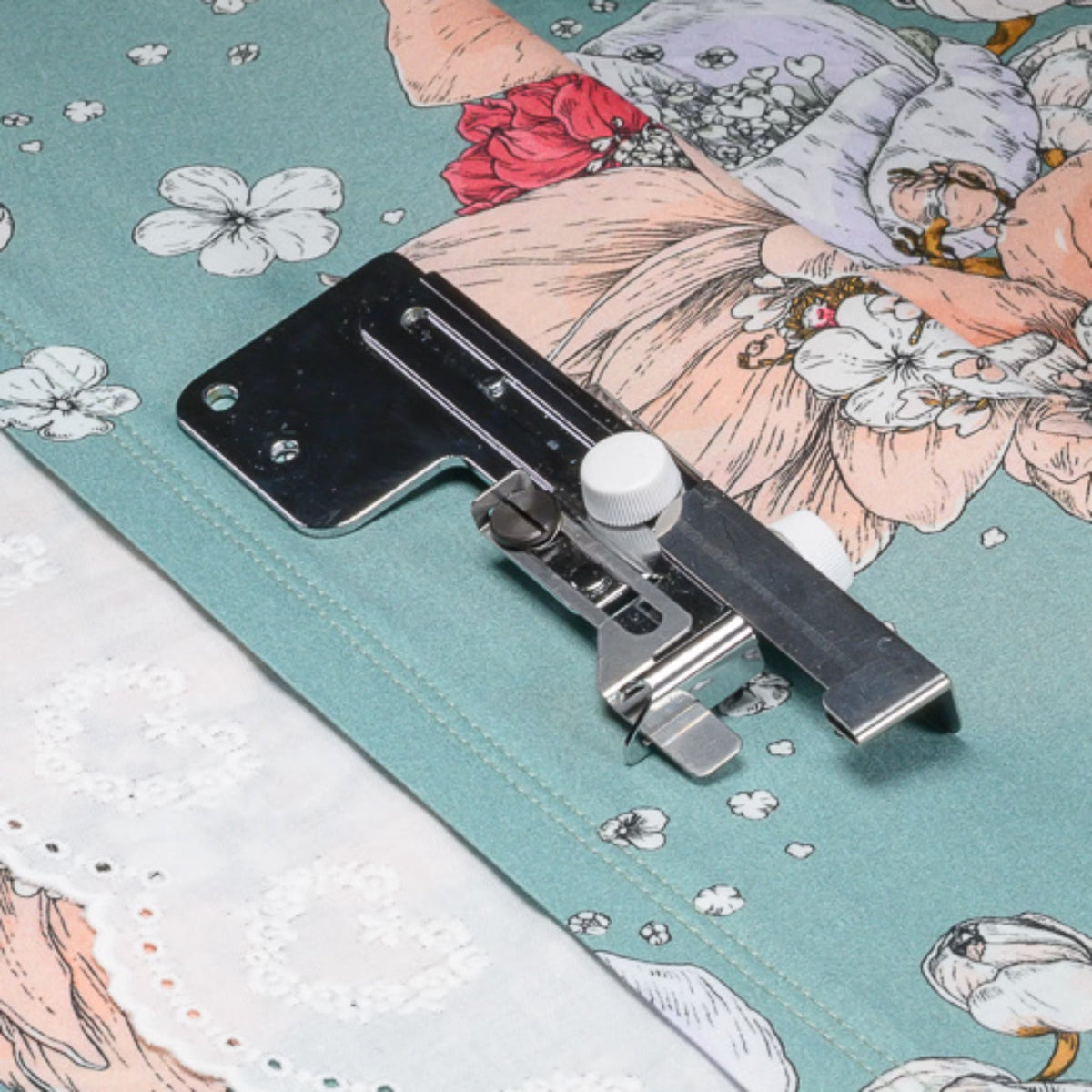 Hemming guide on a piece of floral fabric.