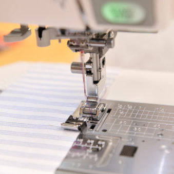 Overcast foot sewing on striped fabric